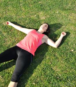 exhausted-woman-lying-on-grass
